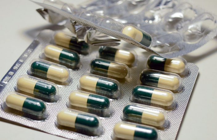 Split Green and White Tablets Appear in Over-the-Counter Pill Packaging
