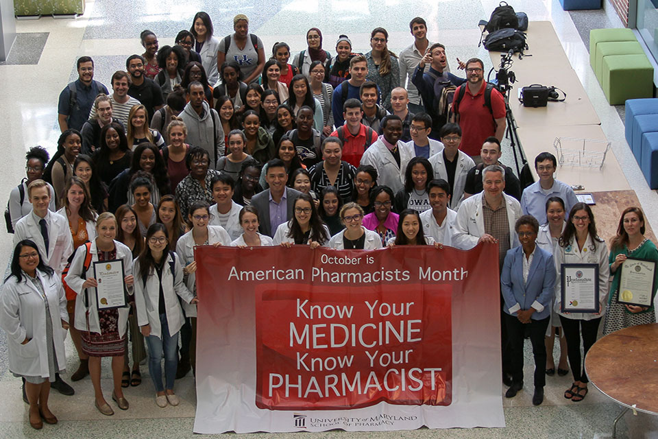Student pharmacists pose for photo with School leadership in celebration of American Pharmacists Month.