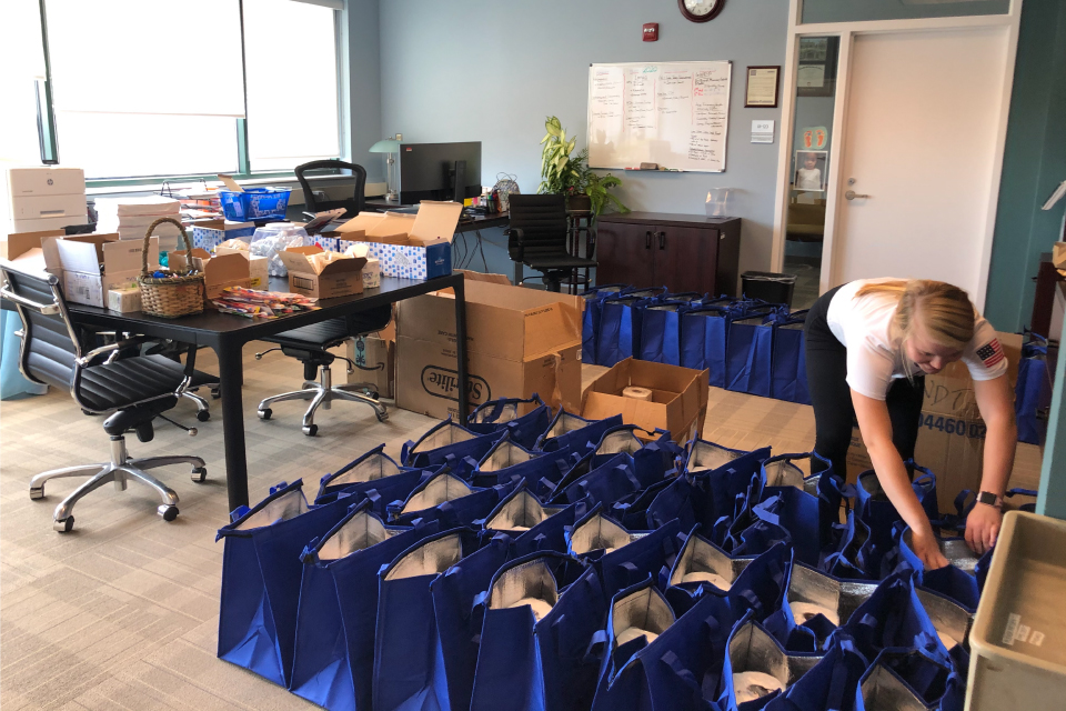 A room full of gift bags to be delivered to West Baltimore from the Lamy Center at UM-SOP
