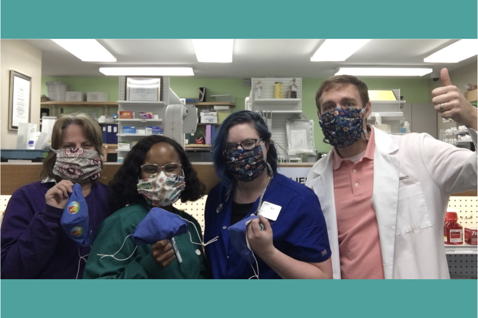 Four Employees at Finksburg Pharmacy Wearing Masks and Holding Masks Up