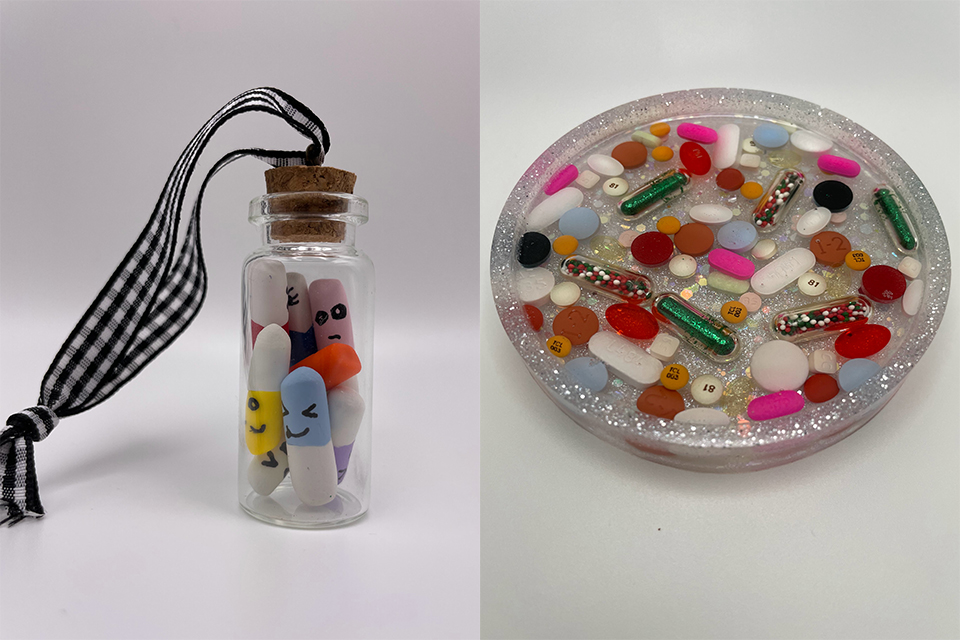 A small glass vial filled with medications with faces drawn on, and a coaster filled with medications in epoxy.
